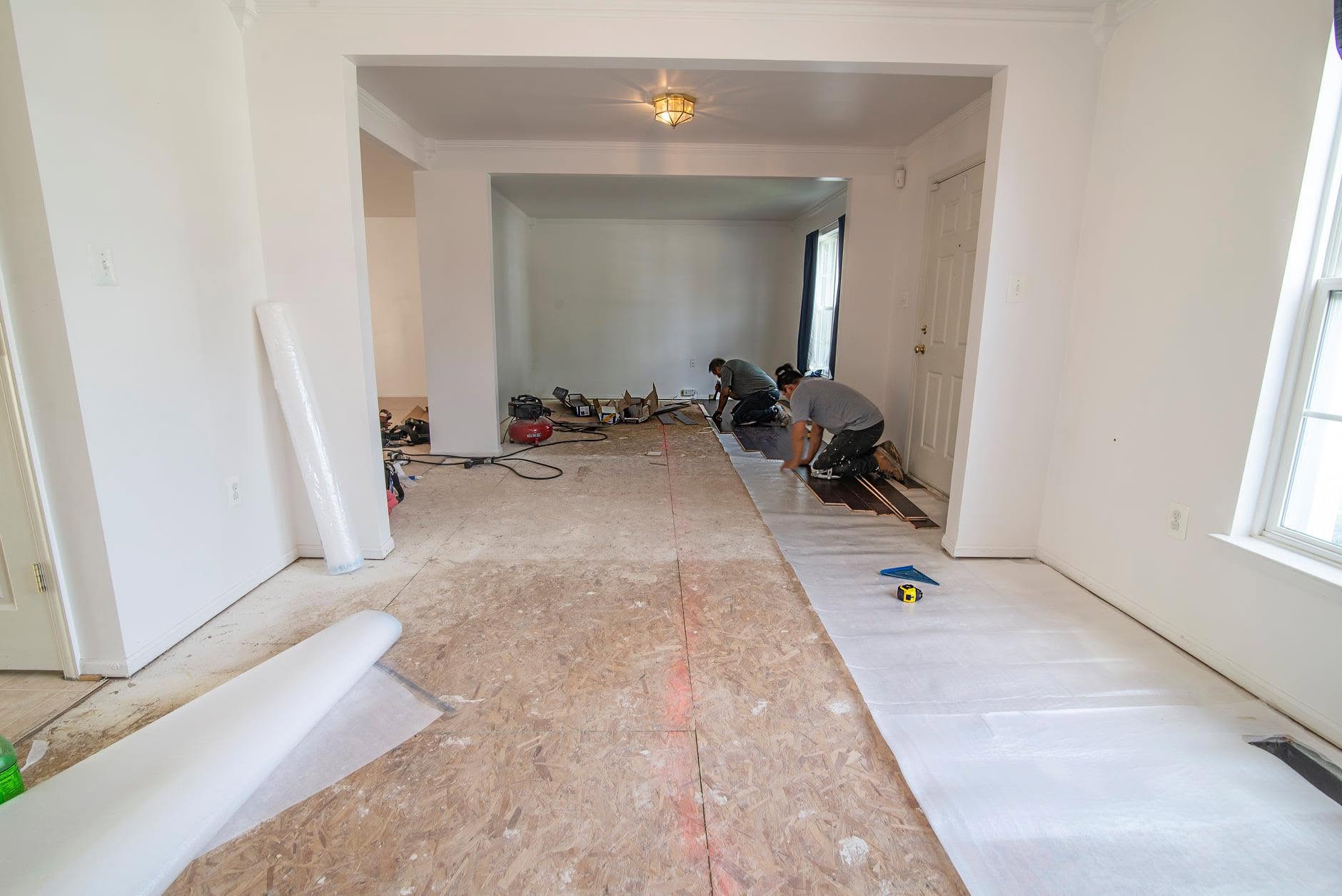 Before: room with bare subfloor prepped for new flooring
