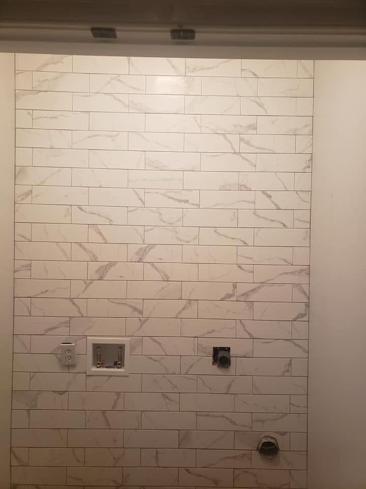 Laundry · marble-look subway tile, floor to ceiling