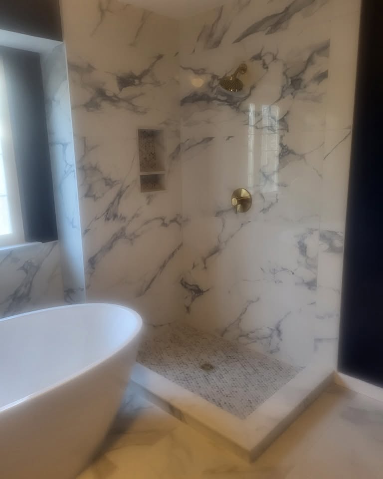 Bathroom · marble-look shower beside a freestanding tub