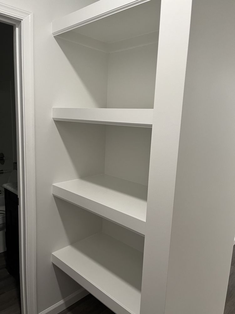 Built-ins · white shelves set into the wall