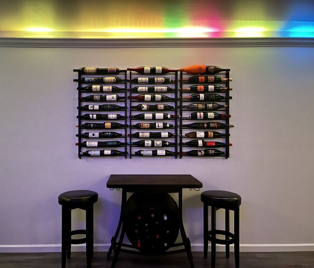Bar wall · wine rack under LED accent lighting